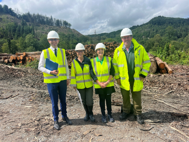 Janet Finch-Saunders MS, with Dylan Williams, Land and Asset Manager, NRW, and Kath McNulty, Team Leader Forest Operations, NRW, in a section of the Gwydir forest by Betws y Coed